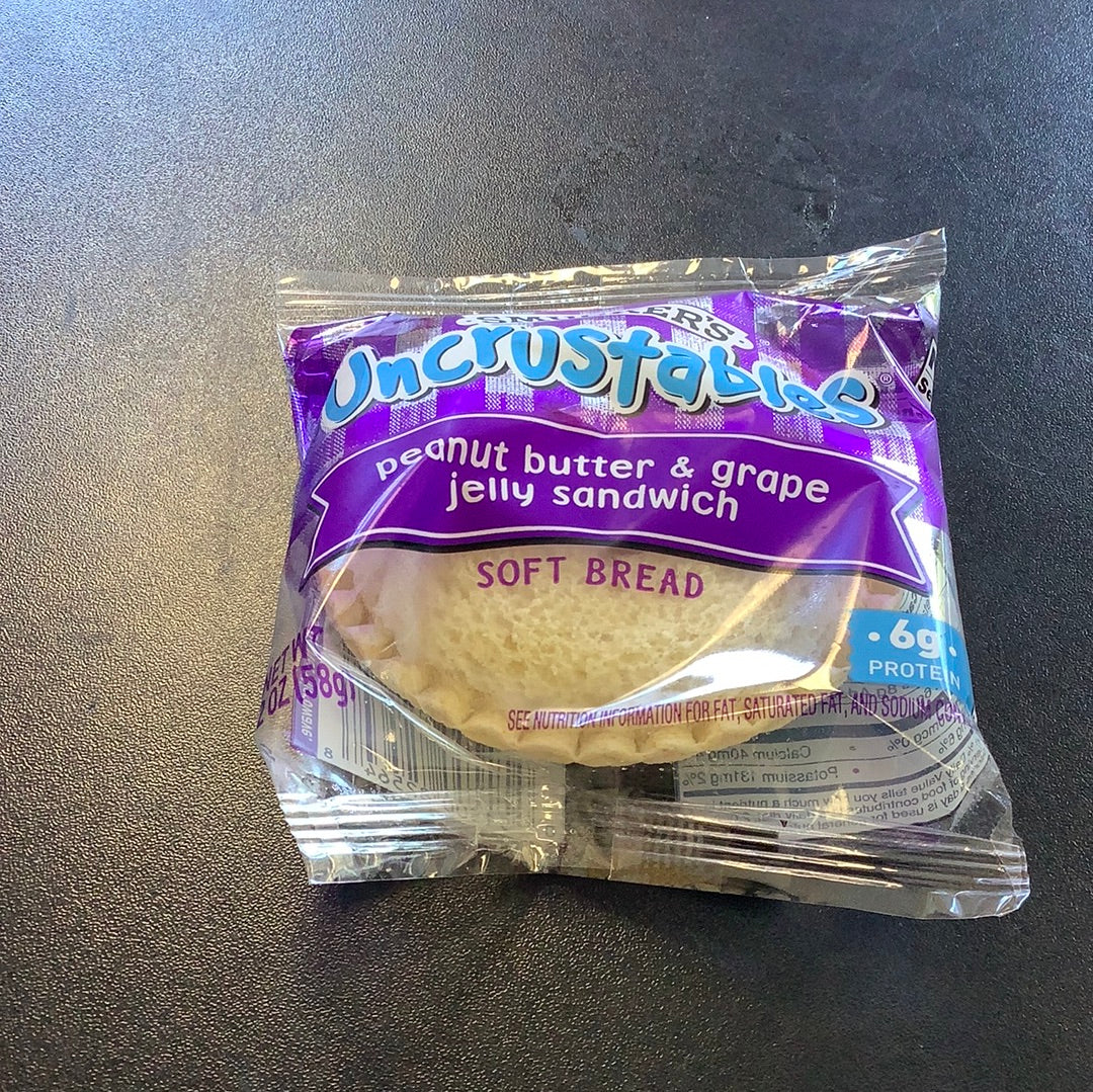 Smuckers uncrustables peanut butter & grape sandwich