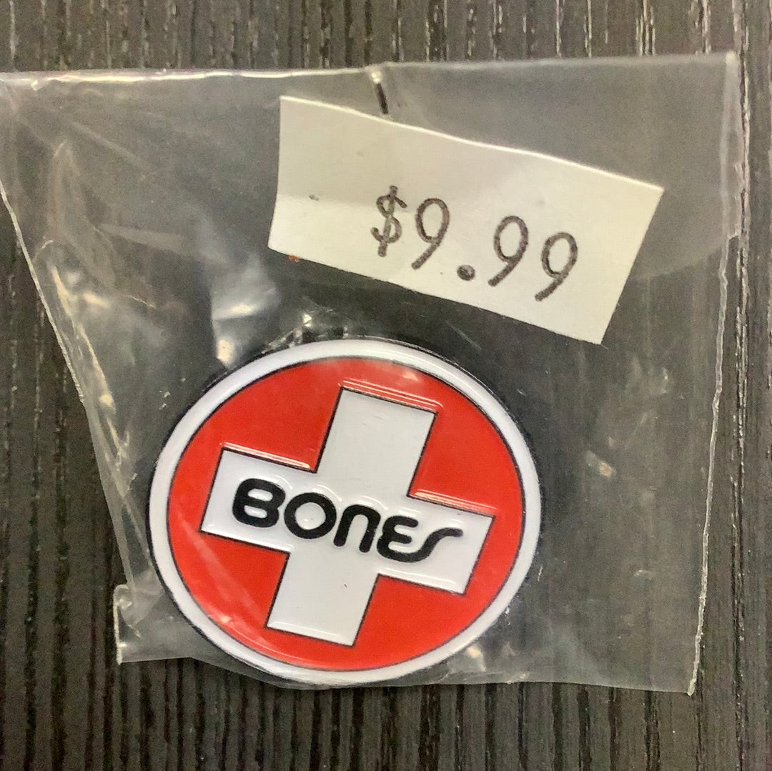 Bones pin Swiss logo
