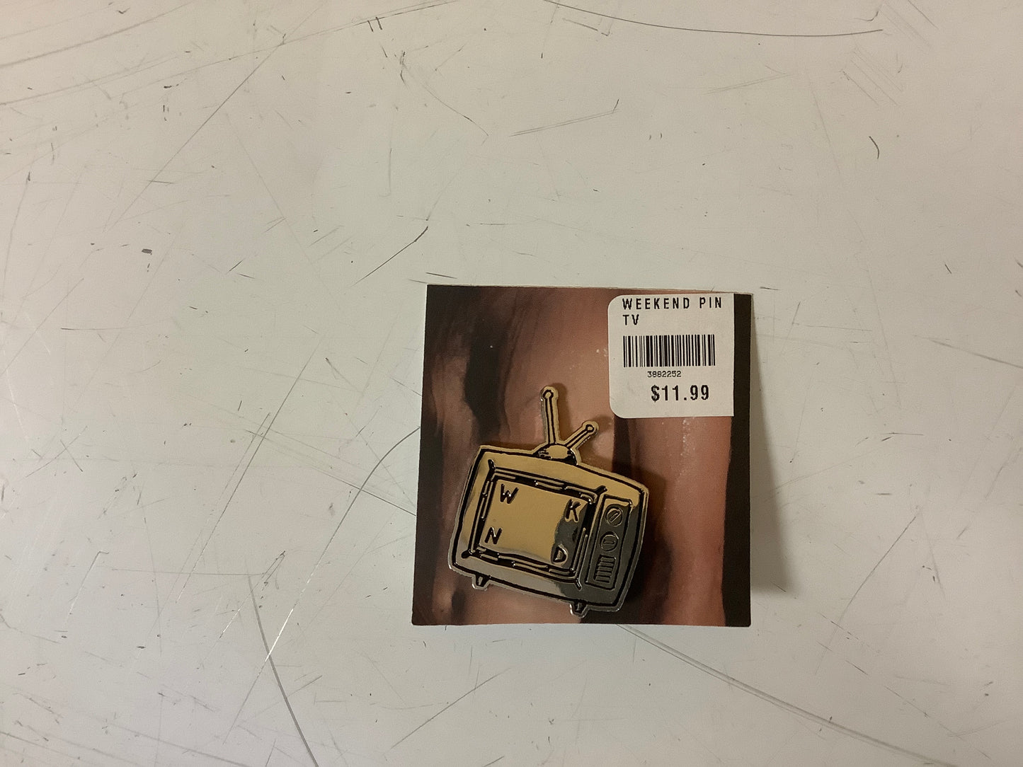Weekend lapel pin TV