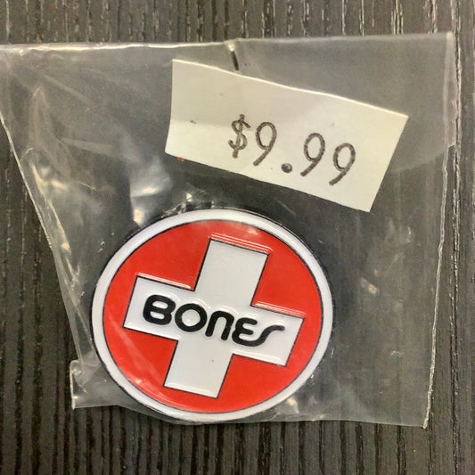 Bones pin Swiss logo